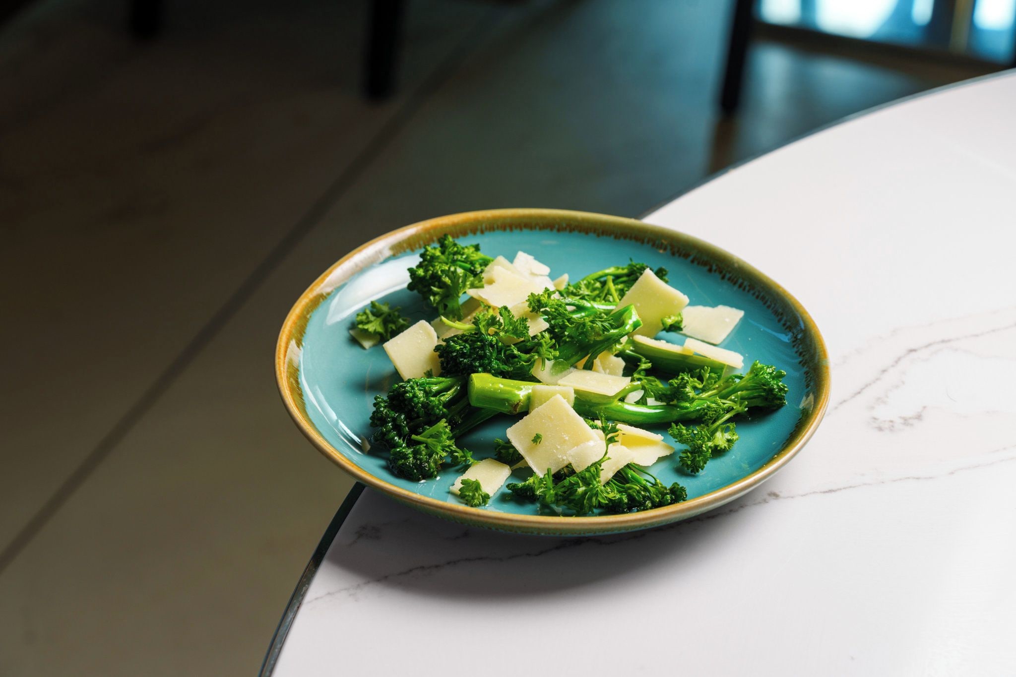 A bowl of food on a white table.