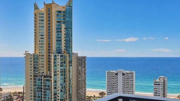 A high-rise hotel with multiple floors, a beach view, and a clear sky. - Bright Open view 2 bedroom Apartment in Gold Coast (Surfers Paradise)