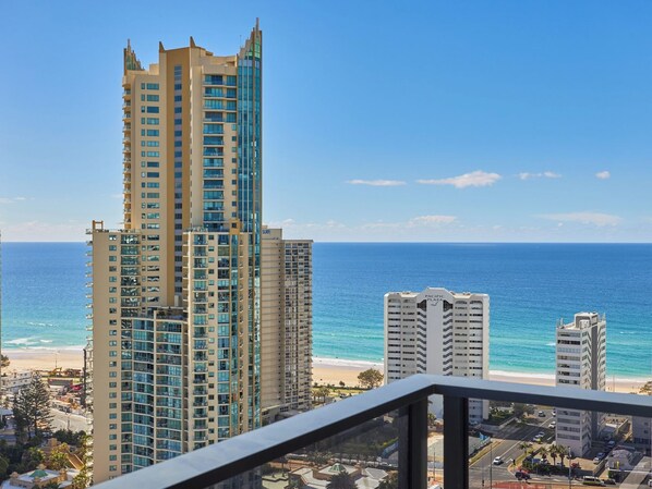 A high-rise building with a view of the beach and ocean.