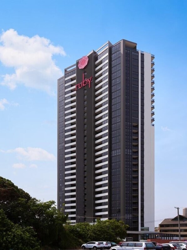 A tall building with a prominent 'ruby' logo on the side.