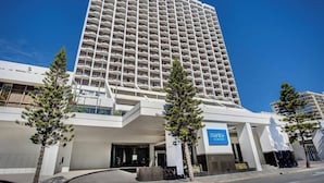 A tall hotel with a modern design, featuring a prominent entrance and a sign for 'Mantra on View Hotel.' - Ocean View 2 Double-bed Hotel Room | 2min to Beach (Surfers Paradise)