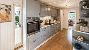 Coffee/tea maker, fridge, stovetop, dishwasher