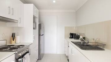 Coffee/tea maker, fridge, microwave, oven