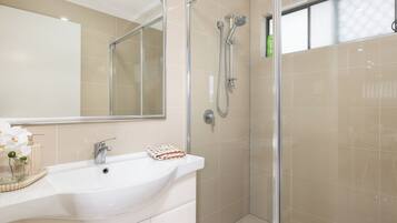 Shower, hair dryer, soap, shampoo