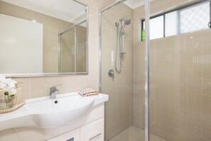 Shower, hair dryer, soap, shampoo