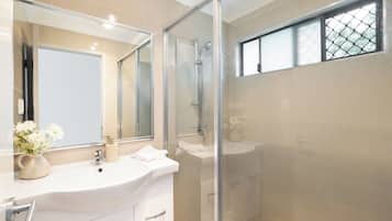 Shower, hair dryer, towels, soap