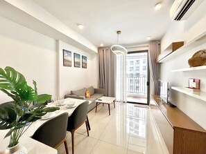 City Apartment, Balcony, Partial Lake View | Living area - Golden Apartment (Ho Chi Minh City)
