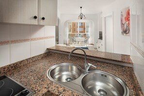 Fridge, microwave, stovetop, coffee/tea maker