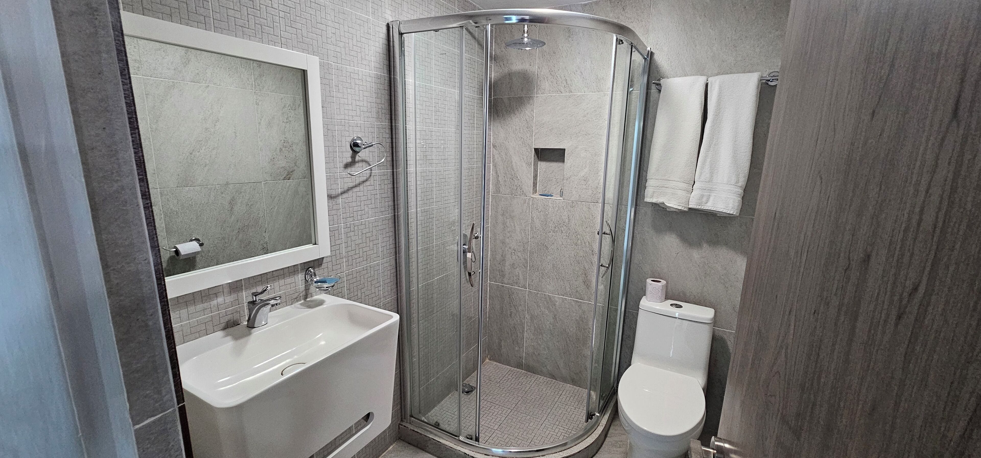 Shower, hair dryer, towels, soap