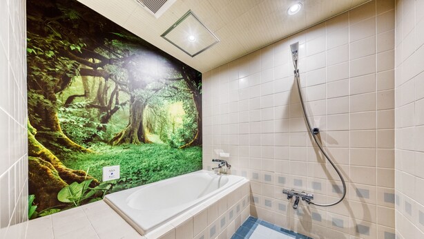 A bathroom with a large bathtub, a shower, and a wall mural of a forest scene. - Hotel Lotus morioka - Adult Only (Shizukuishi)