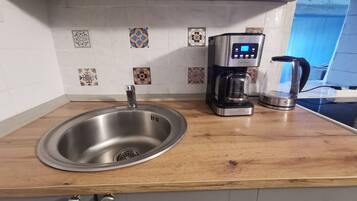 Fridge, microwave, stovetop, coffee/tea maker