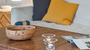 A cozy living room with a wooden coffee table, a woven basket, and a magazine. - "Karl" - 4km from the sea by Interhome (Frederiksværk)