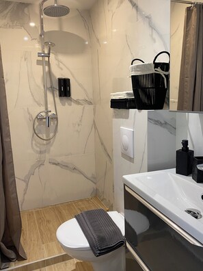 Shower, hair dryer, towels, soap
