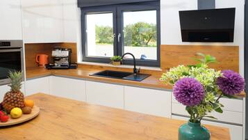 Fridge, coffee/tea maker, cookware/dishes/utensils