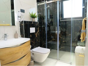 Shower, hair dryer, towels, soap