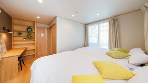 A bedroom with a bed, a desk, and shelves. - Convertel Daita Setagaya Daita by Tranova (Tokyo)