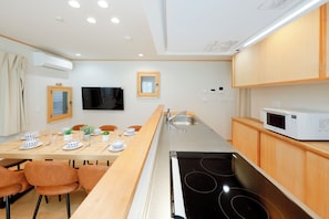 Basic Apartment | Private kitchen | Full-size fridge, microwave, stovetop, electric kettle
