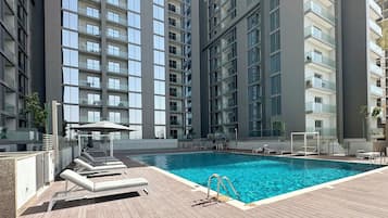 Outdoor pool, pool umbrellas, pool loungers