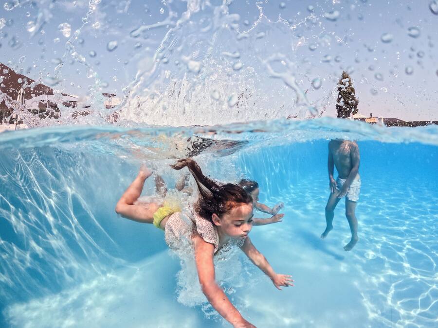 Seasonal outdoor pool, open 9:00 AM to 8:00 PM, pool umbrellas