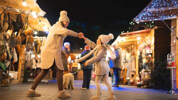 A nighttime outdoor market with stalls and people.
