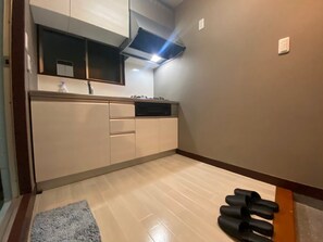 102, Non Smoking | Private kitchen | Full-size fridge, microwave, stovetop, cookware/dishes/utensils - OK Building Ikebukuro Honcho (Tokyo)