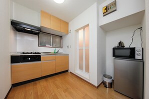 101, Non Smoking | Private kitchen | Full-size fridge, microwave, stovetop, cookware/dishes/utensils - OK Building Ikebukuro Honcho (Tokyo)