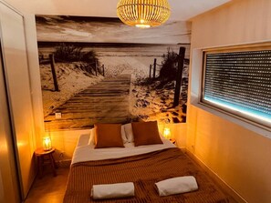 1 bedroom, desk, iron/ironing board, travel crib