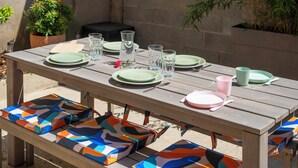A wooden picnic table set with plates, glasses, and benches. - F3 au Coeur des Cordiers, Avec Parking Privatif Inclus (Le Tréport)