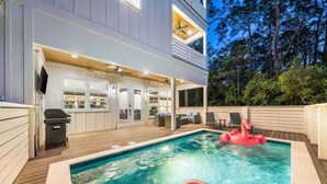 A modern house with a swimming pool, outdoor furniture, and a flamingo float. - Cote D' Azur • Private Pool Retreat on 30A • Golf Cart 🛺 (Seagrove Beach)