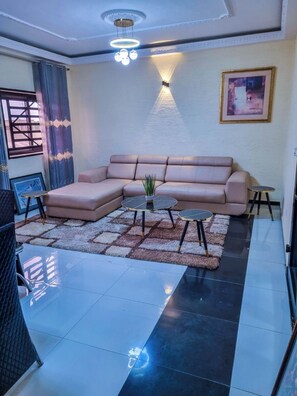 Superior Apartment | Living area | 33-inch flat-screen TV with cable channels
