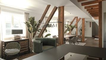 Apartamento exclusivo, 2 habitaciones | Zona de estar | Smart TV de 60 pulgadas con canales digitales