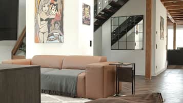 Exclusive Condo, 2 Bedrooms | Living area | 60-inch Smart TV with digital channels