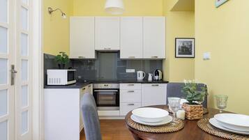 Apartment, 2 Bedrooms, Balcony | Private kitchen | Microwave, dishwasher, coffee/tea maker, cookware/dishes/utensils