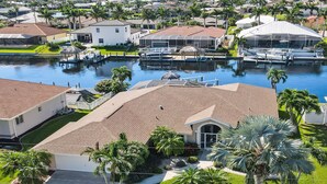 A residential area with houses, a marina, and a swimming pool.