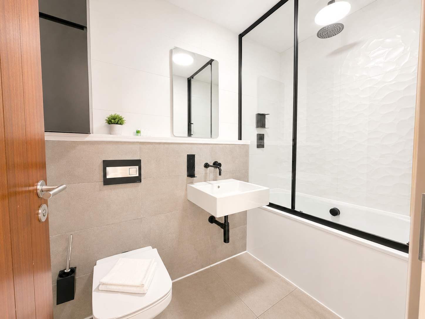 Shower, hair dryer, towels, shampoo