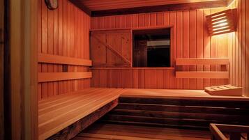 A wooden sauna with a bench, a window, and a clock on the wall.