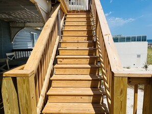 A wooden staircase leading to a beach house with a view of the ocean. - BDWK#2: Pet-Friendly Beachfront + Free Activities (Pensacola)