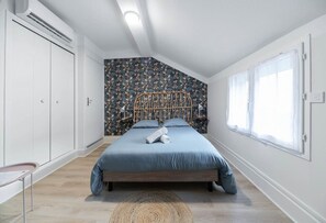 1 bedroom, desk, iron/ironing board, travel crib