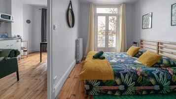 1 bedroom, desk, iron/ironing board, travel crib