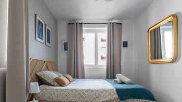 1 bedroom, desk, iron/ironing board, travel crib