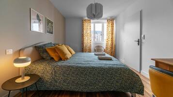 1 bedroom, desk, iron/ironing board, travel crib