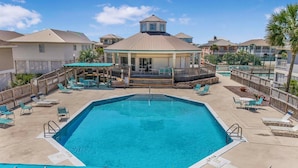 A swimming pool with lounge chairs and a gazebo. - ⭐Short, Easy Walk to Beach-2 Community Pools-Balcony with Views-Harbor Light⭐ (Gulf Shores)