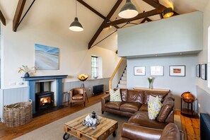 Fireplace - Nyth Y Wennol - sleeps 8 guests in 4 bedrooms (Brynsiencyn)