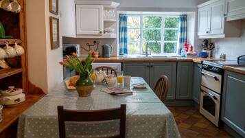 Fridge, dishwasher, dining tables