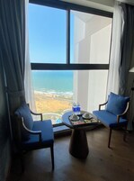 Family Quadruple Room, Sea View | Living area | 45-inch LED TV with cable channels