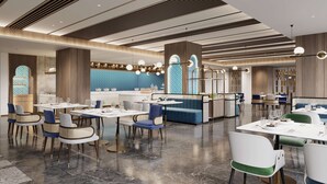 A modern restaurant with a central bar area, multiple seating options including booths and tables, and a decorative ceiling with linear patterns. - Hilton Garden Inn Ili Yining (Yining)