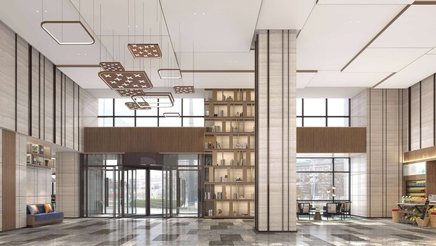 A spacious lobby with a central revolving door, a large bookshelf, and a seating area with a coffee machine. - Hilton Garden Inn Ili Yining (Yining)