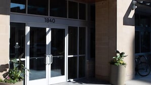 A building entrance with a sign reading "URBANITE" and the number "1840" above the doors.