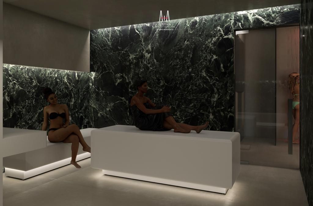 Un área de spa moderna con paredes de mármol y un mostrador de recepción blanco.