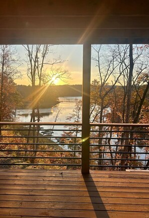 Enjoy a serene view of the surrounding landscape from this outdoor deck.